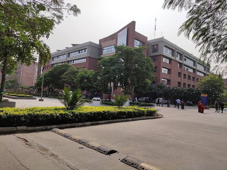 Amity University's Noida campus building, seen from the approach road